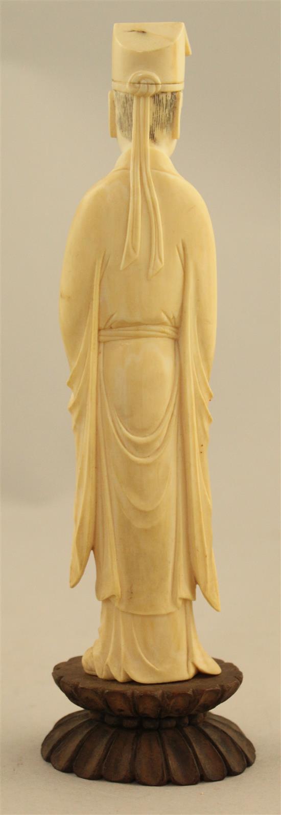 A Chinese ivory figure of a scholar, early 20th century, 17.5cm incl. stand, fitted box